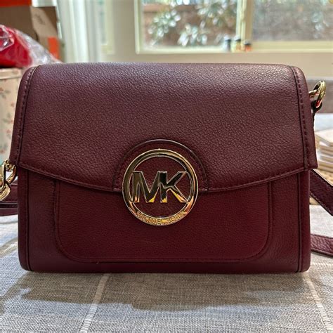 burgundy michael kors bag with burgundy puff ball|burgundy Michael Kors crossbody.